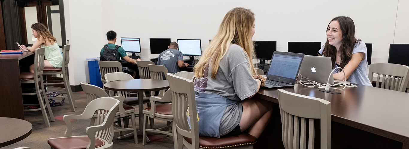 Students in between classes at the Library Commons